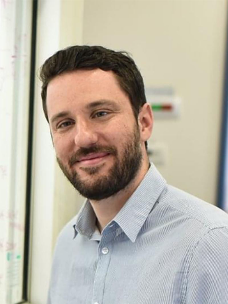 Matthew Suss headshot, white man with dark hair and beard